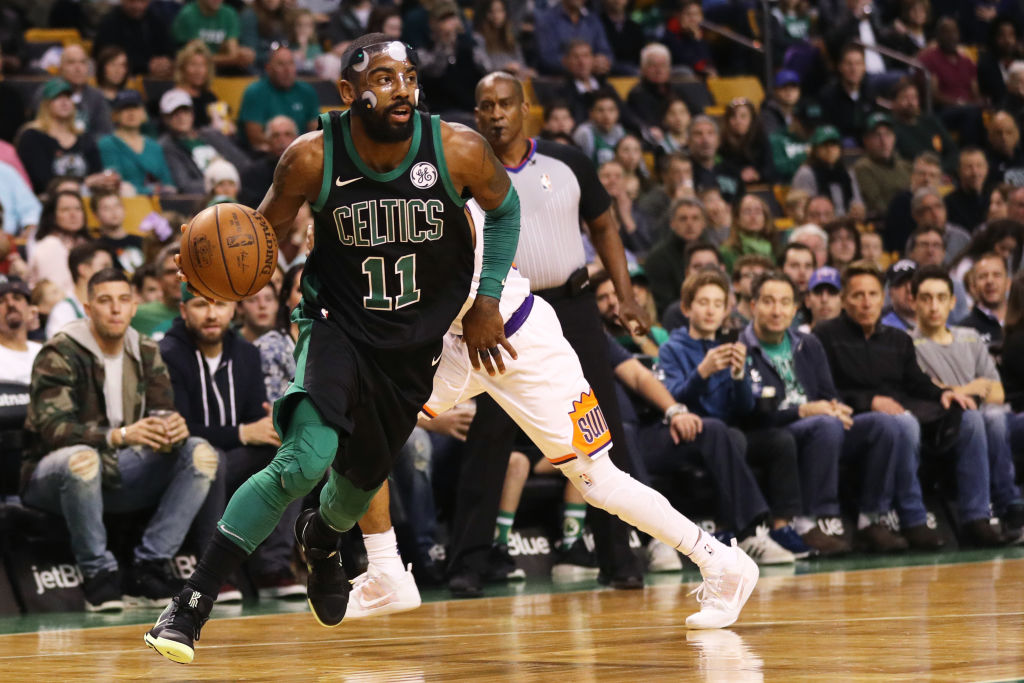 BOSTON, MA - DECEMBER 2: Kyrie Irving #11 of the Boston Celtics dribbles against the Phoenix Suns during the first half at TD Garden on December 2, 2017 in Boston, Massachusetts. 
