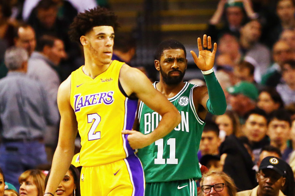 BOSTON, MA - NOVEMBER 08: Lonzo Ball #2 of the Los Angeles Lakers and Kyrie Irving #11 of the Boston Celtics react during the first quarter of their game at TD Garden on November 8, 2017 in Boston, Massachusetts.
