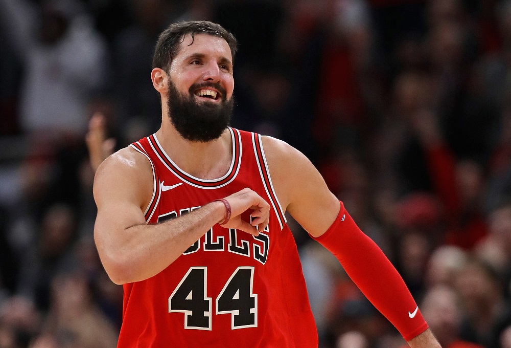 CHICAGO, IL - DECEMBER 18: Nikola Mirotic #44 of the Chicago Bulls celebrates as he runs down the court after hitting a 3 point shot late in the game against the Philadelphia 76ers at the United Center on December 18, 2017 in Chicago, Illinois. The Bulls defeated the 76ers 117-115