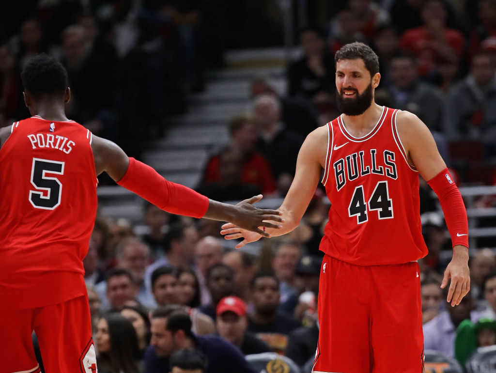CHICAGO, IL - DECEMBER 18: Nikola Mirotic #44 and Bobby Portis #5 of the Chicago Bulls congratulate each other after a play against the Philadelphia 76ers at the United Center on December 18, 2017 in Chicago, Illinois. The Bulls defeated the 76ers 117-115