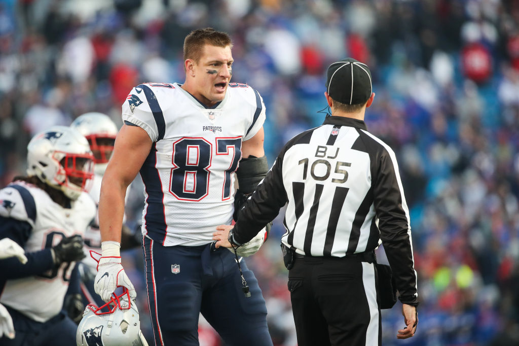 Rob Gronkowski #87 of the New England Patriots talks with back judge Dino Paganelli #105 during the fourth quarter against the Buffalo Bills on December 3, 2017 at New Era Field in Orchard Park, New York.