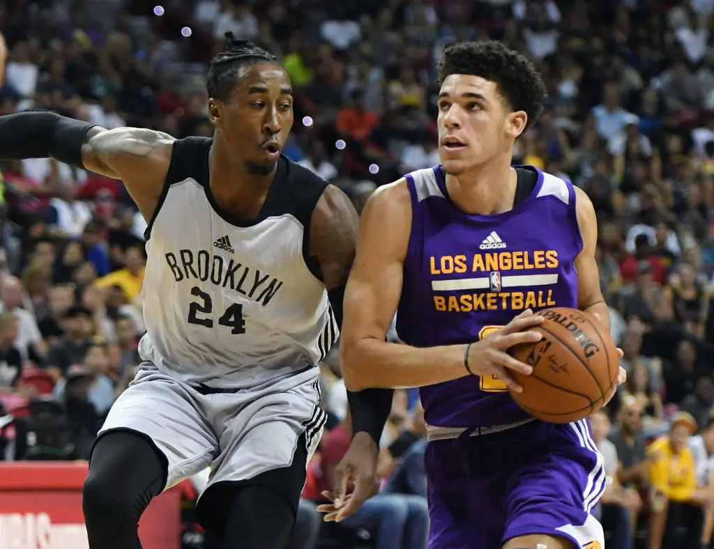 LAS VEGAS, NV - JULY 15: Lonzo Ball #2 of the Los Angeles Lakers drives against Rondae Hollis-Jefferson #24 of the Brooklyn Nets during the 2017 Summer League at the Thomas & Mack Center on July 15, 2017 in Las Vegas, Nevada