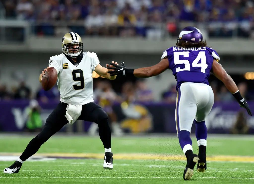 MINNEAPOLIS, MN - SEPTEMBER 11: Drew Brees #9 of the New Orleans Saints scrambles with the ball as he is pursued by Eric Kendricks #54 of the Minnesota Vikings in the first half of the game on September 11, 2017 at U.S. Bank Stadium in Minneapolis, Minnesota.