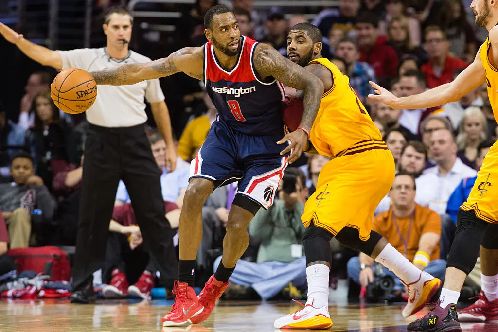 CLEVELAND, OH - NOVEMBER 26: Rasual Butler #8 of the Washington Wizards post up against Kyrie Irving #2 of the Cleveland Cavaliers during the first half at Quicken Loans Arena on November 26, 2014 in Cleveland, Ohio.