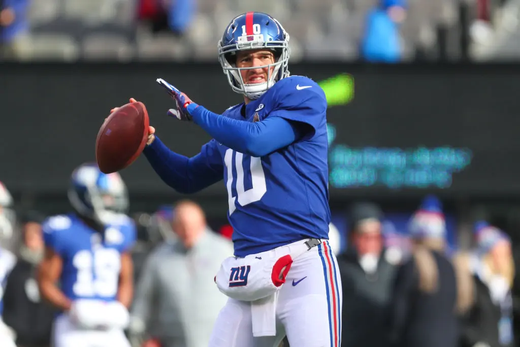 EAST RUTHERFORD, NJ - DECEMBER 31: Eli Manning #10 of the New York Giants throws a pass during warmups for the NFL game against the Washington Redskins at MetLife Stadium on December 31, 2017 in East Rutherford, New Jersey. (Photo by Ed Mulholland/Getty Images)