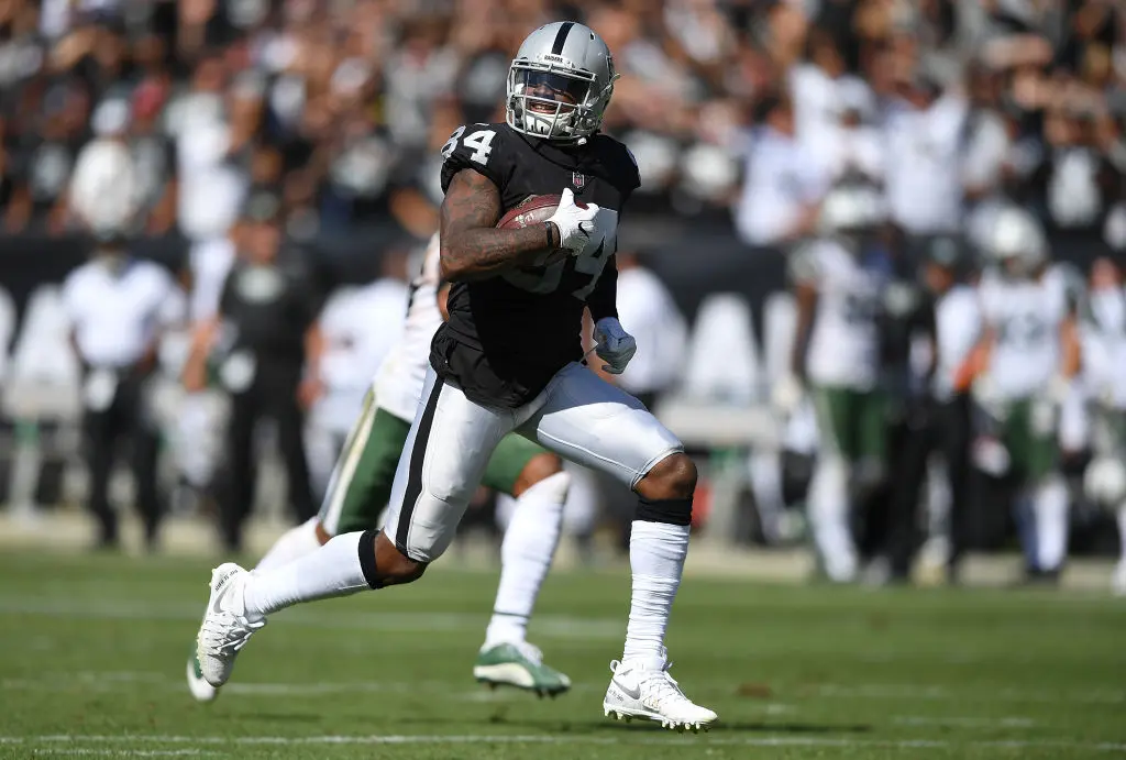 OAKLAND, CA - SEPTEMBER 17: Cordarrelle Patterson #84 of the Oakland Raiders scores on a 43 yard touchdown run against the New York Jets during the third quarter of their NFL football game at Oakland-Alameda County Coliseum on September 17, 2017 in Oakland, California.