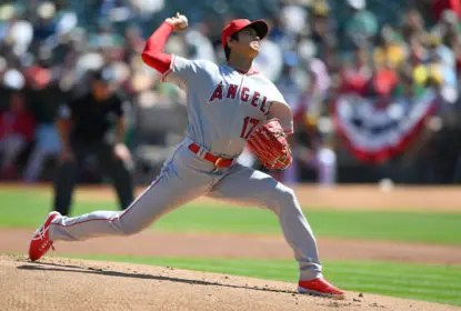 OAKLAND, CA - APRIL 01: Shohei Ohtani #17 of the Los Angeles Angels of Anaheim pitches in the bottom of the first inning of his Major League pitching debut against the Oakland Athletics at Oakland Alameda Coliseum on April 1, 2018 in Oakland, California.