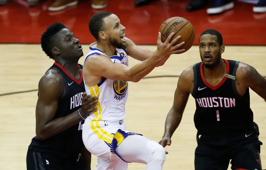 HOUSTON, TX - MAY 28: Stephen Curry #30 of the Golden State Warriors goes up against Clint Capela #15 and Trevor Ariza #1 of the Houston Rockets in the second quarter of Game Seven of the Western Conference Finals of the 2018 NBA Playoffs at Toyota Center on May 28, 2018 in Houston, Texas