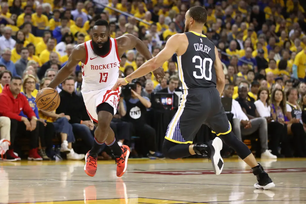 OAKLAND, CA - MAY 22: James Harden #13 of the Houston Rockets drives with the ball against Stephen Curry #30 of the Golden State Warriors during Game Four of the Western Conference Finals of the 2018 NBA Playoffs at ORACLE Arena on May 22, 2018 in Oakland, California