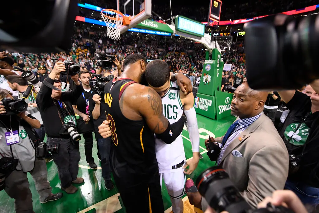 BOSTON, MA - MAY 27: LeBron James #23 of the Cleveland Cavaliers and Jayson Tatum #0 of the Boston Celtics hug after the Cleveland Cavaliers win the game 87-79 during Game Seven of the Eastern Conference Finals of the 2018 NBA Playoffs between the Cleveland Cavaliers and Boston Celtics on May 27, 2018 at the TD Garden in Boston, Massachusetts
