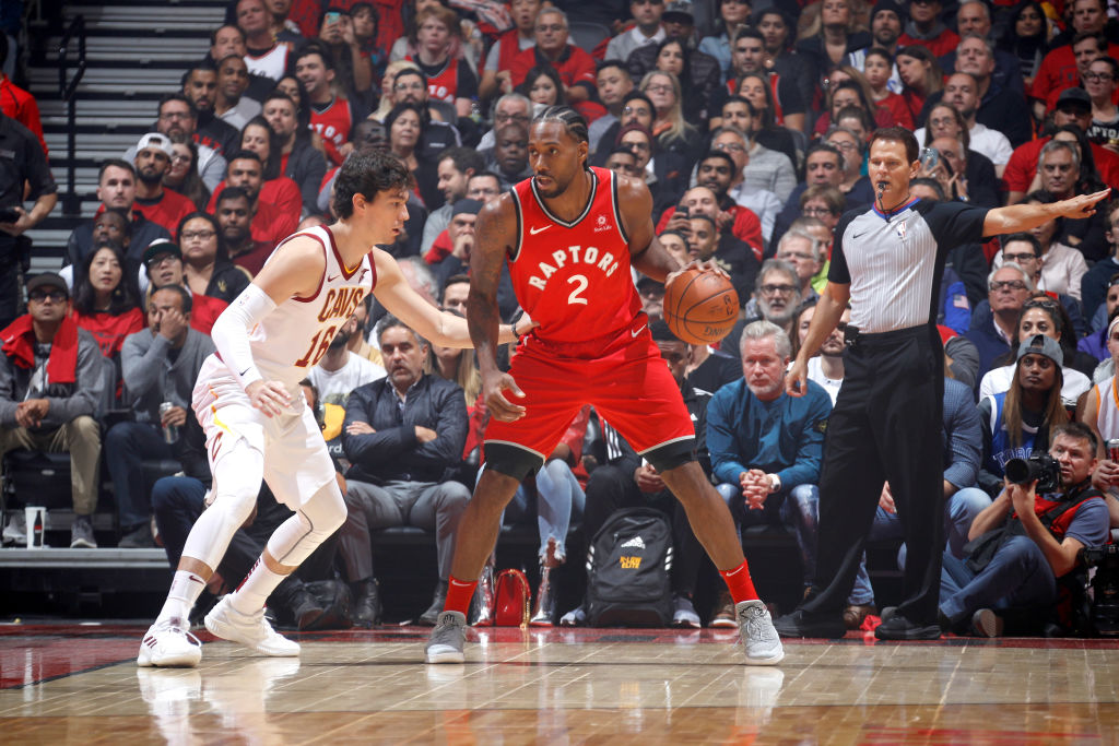 TORONTO, CANADA - OCTOBER 17: Kawhi Leonard #2 of the Toronto Raptors handles the ball against the Cleveland Cavaliers on October 17, 2018 at Scotiabank Arena in Toronto, Ontario, Canada