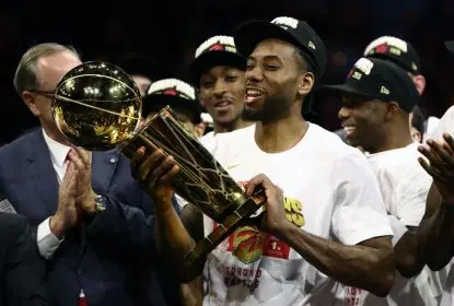 OAKLAND, CALIFORNIA - JUNE 13: Kawhi Leonard #2 of the Toronto Raptors celebrates with the Larry O'Brien Championship Trophy after his team defeated the Golden State Warriors to win Game Six of the 2019 NBA Finals at ORACLE Arena on June 13, 2019 in Oakland, California.