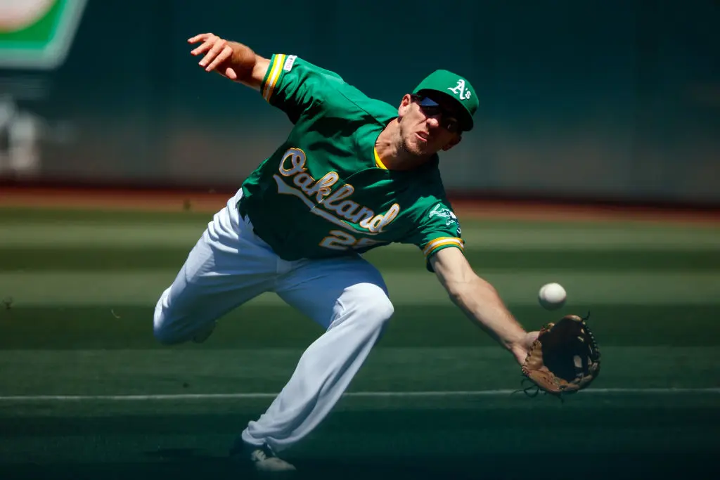 OAKLAND, CA - JUNE 02: Stephen Piscotty #25 of the Oakland Athletics dives for but is unable to field a foul ball hit off the bat of Myles Straw (not pictured) of the Houston Astros during the fifth inning at the Oakland Coliseum on June 2, 2019 in Oakland, California