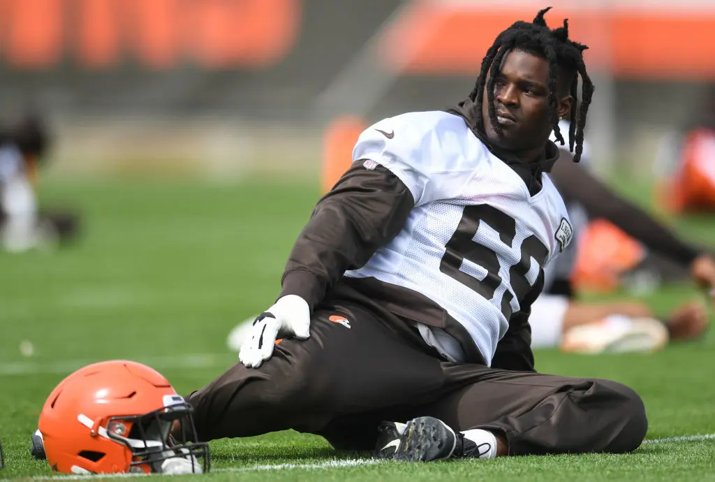 BEREA, OH - MAY 22, 2019: Offensive tackle Desmond Harrison #69 of the Cleveland Browns stretches during an OTA practice on May 22, 2019 at the Cleveland Browns training facility in Berea, Ohio