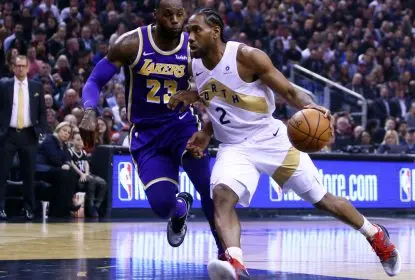 TORONTO, ON - MARCH 14: Kawhi Leonard #2 of the Toronto Raptors dribbles the ball as LeBron James #23 of the Los Angeles Lakers defends during the first half of an NBA game at Scotiabank Arena on March 14, 2019 in Toronto, Canada.