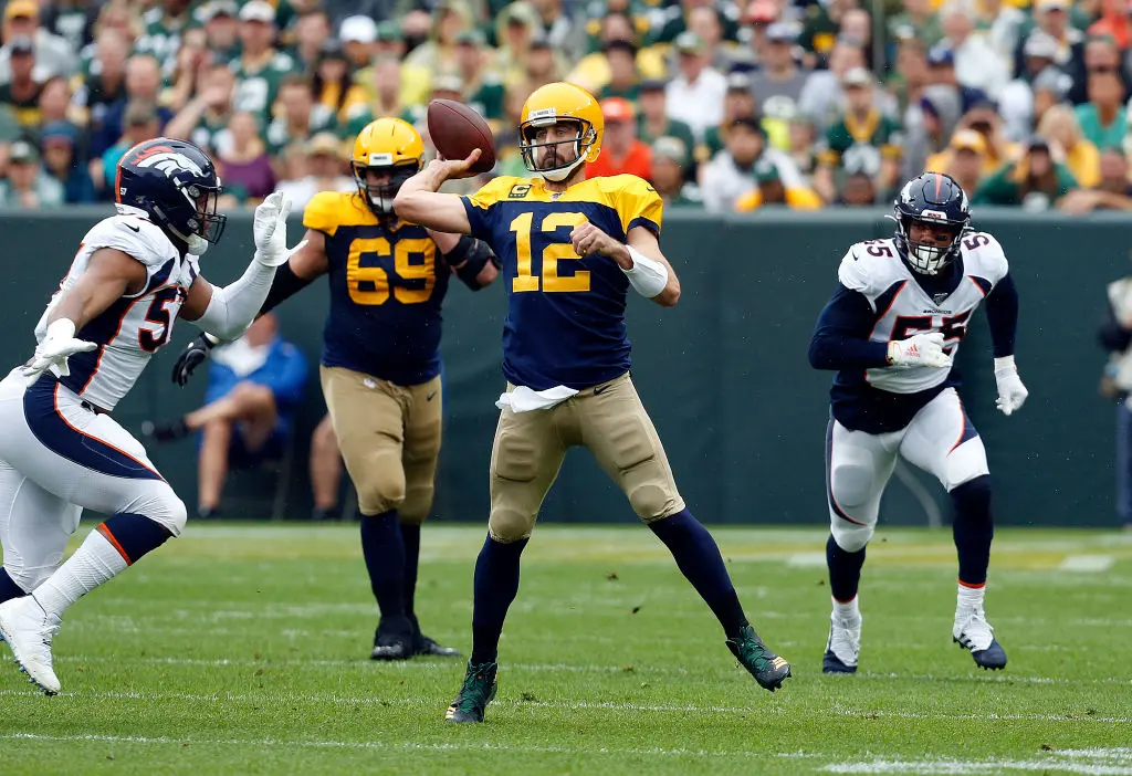 GREEN BAY, WISCONSIN - SEPTEMBER 22: Aaron Rodgers #12 of the Green Bay Packers throws a pass against the Denver Broncos during the first quarter at Lambeau Field on September 22, 2019 in Green Bay, Wisconsin