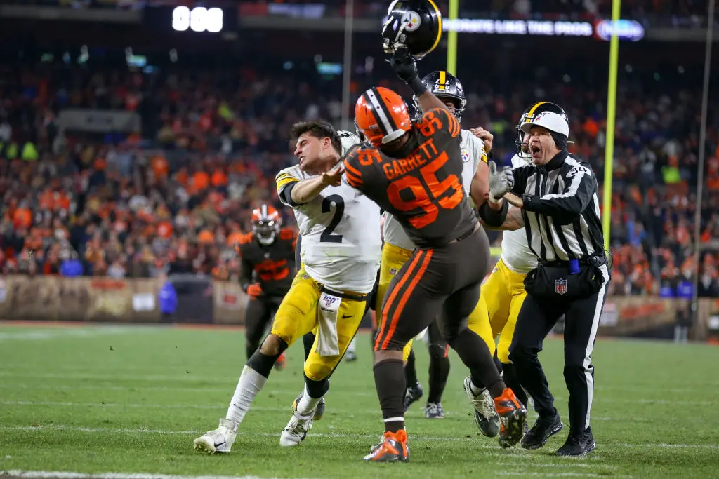 CLEVELAND, OH - NOVEMBER 14: Cleveland Browns defensive end Myles Garrett (95) swings at Pittsburgh Steelers quarterback Mason Rudolph (2) with Rudolphs own helmet with 0:08 seconds left in the fourth quarter of the National Football League game between the Pittsburgh Steelers and Cleveland Browns on November 14, 2019, at FirstEnergy Stadium in Cleveland, OH.