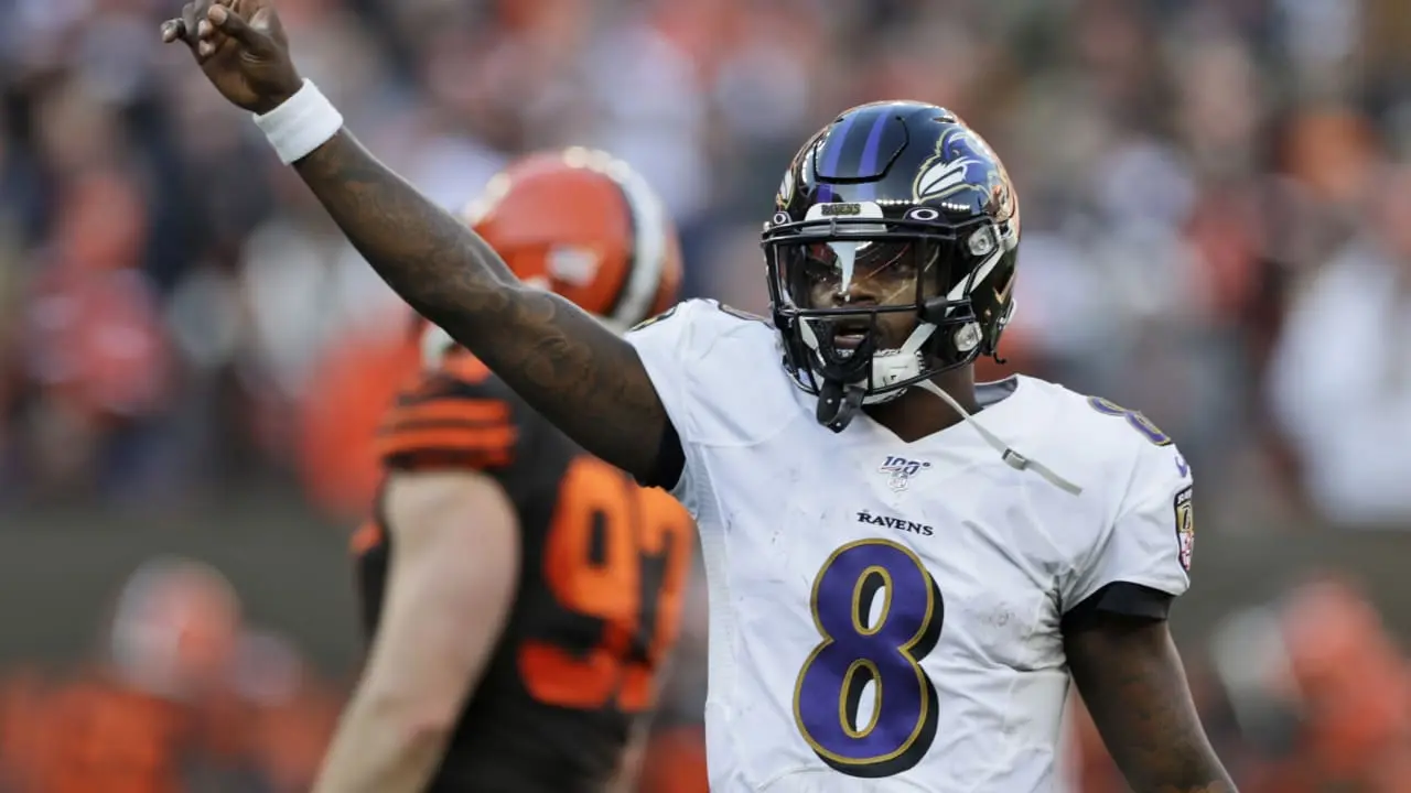 Quarterback do Baltimore Ravens Lamar Jackson em ação durante a semana 16 da NFL 2019