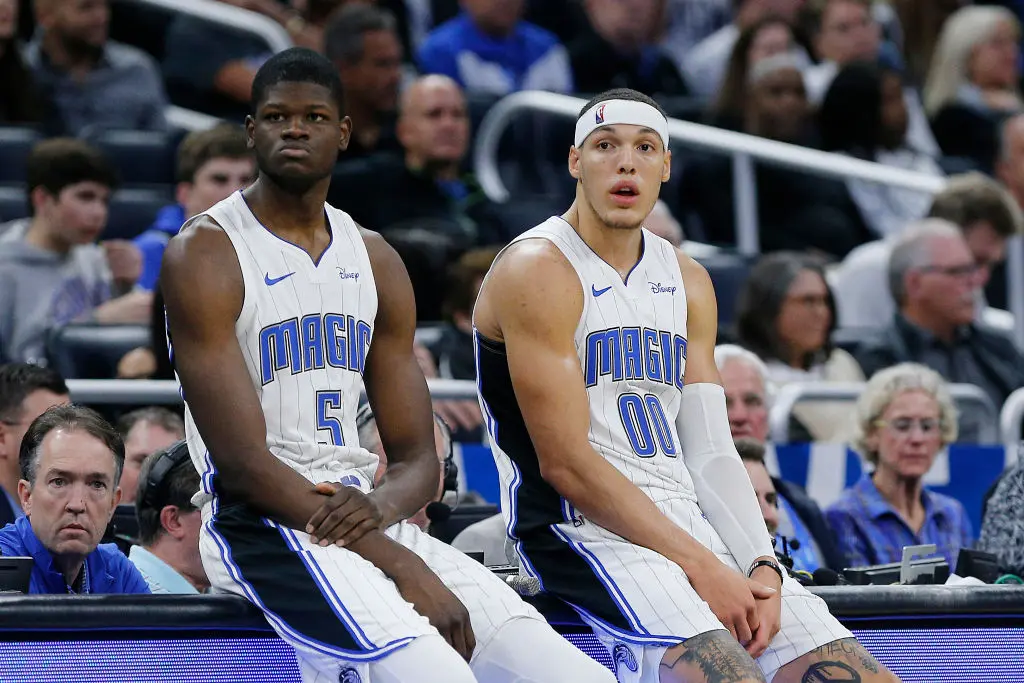 ORLANDO, FLORIDA - DECEMBER 04: Mo Bamba #5 and Aaron Gordon #00 of the Orlando Magic wait to check in against the Phoenix Suns during the second half at Amway Center on December 04, 2019 in Orlando, Florida
