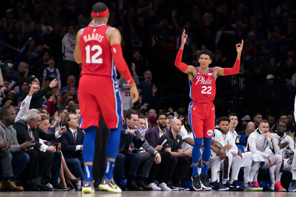PHILADELPHIA, PA - JANUARY 15: Matisse Thybulle #22 and Tobias Harris #12 of the Philadelphia 76ers react after a three point basket by Thybulle against the Brooklyn Nets in the second quarter at the Wells Fargo Center on January 15, 2020 in Philadelphia, Pennsylvania