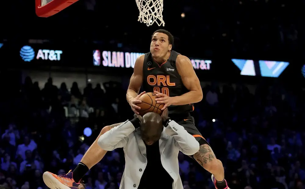 CHICAGO, ILLINOIS - FEBRUARY 15: Aaron Gordon #00 of the Orlando Magic dunks the ball over Tacko Fall of the Boston Celtics in the 2020 NBA All-Star - AT&T Slam Dunk Contest during State Farm All-Star Saturday Night at the United Center on February 15, 2020 in Chicago, Illinois