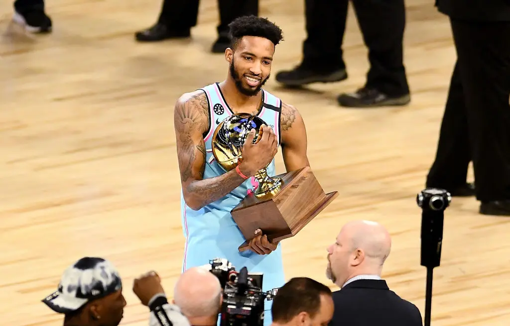 CHICAGO, ILLINOIS - FEBRUARY 15: Derrick Jones Jr. #5 of the Miami Heat celebrates with the trophy after winning the 2020 NBA All-Star - AT&T Slam Dunk Contest during State Farm All-Star Saturday Night at the United Center on February 15, 2020 in Chicago, Illinois