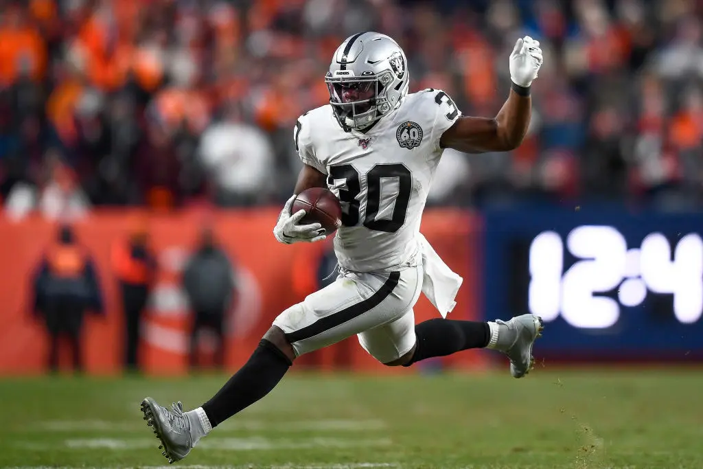 DENVER, CO - DECEMBER 29: Jalen Richard #30 of the Oakland Raiders carries the ball against the Denver Broncos at Empower Field at Mile High on December 29, 2019 in Denver, Colorado