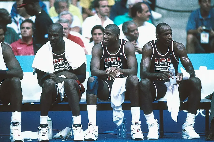 1992: Michael Jordan (L), Magic Johnson (M) and Clyde Drexler (R) of Team USA, the Dream Team, sit on the bench during the men's basketball competition at the 1992 Summer Olympics in Barcelona, Spain.