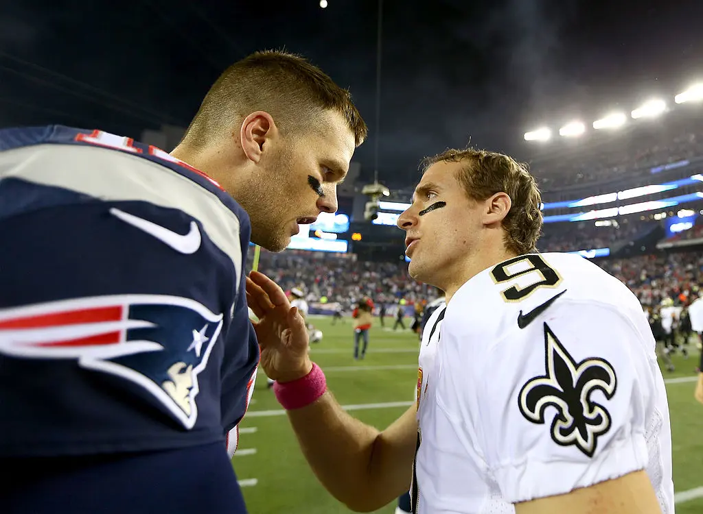 FOXBORO, MA - OCTOBER 13: Tom Brady #12 of the New England Patriots and Drew Brees #9 of the New Orleans Saints talk after the game at Gillette Stadium on October 13, 2013 in Foxboro, Massachusetts.The New England Patriots defeated the New Orleans Saints 30-27.