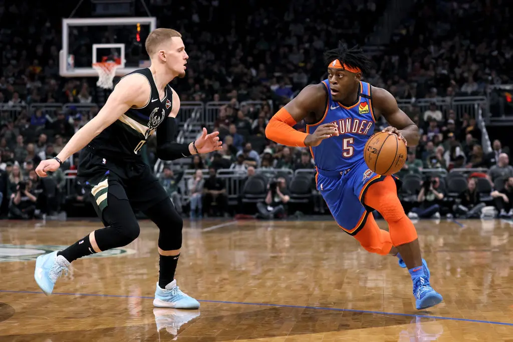 MILWAUKEE, WISCONSIN - FEBRUARY 28: Luguentz Dort #5 of the Oklahoma City Thunder dribbles the ball while being guarded by Donte DiVincenzo #0 of the Milwaukee Bucks in the third quarter at the Fiserv Forum on February 28, 2020 in Milwaukee, Wisconsin
