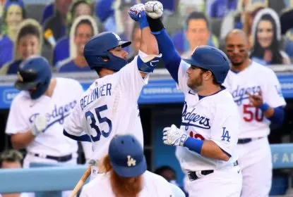 LOS ANGELES, CALIFORNIA - JULY 24: Max Muncy #13 of the Los Angeles Dodgers celebrates his solo homerun with Cody Bellinger #35, to take a 1-0 lead over the San Francisco Giants, during the first inning at Dodger Stadium on July 24, 2020 in Los Angeles, California. The 2020 regular season has been shortened to 60 games due to the COVID-19 Pandemic.