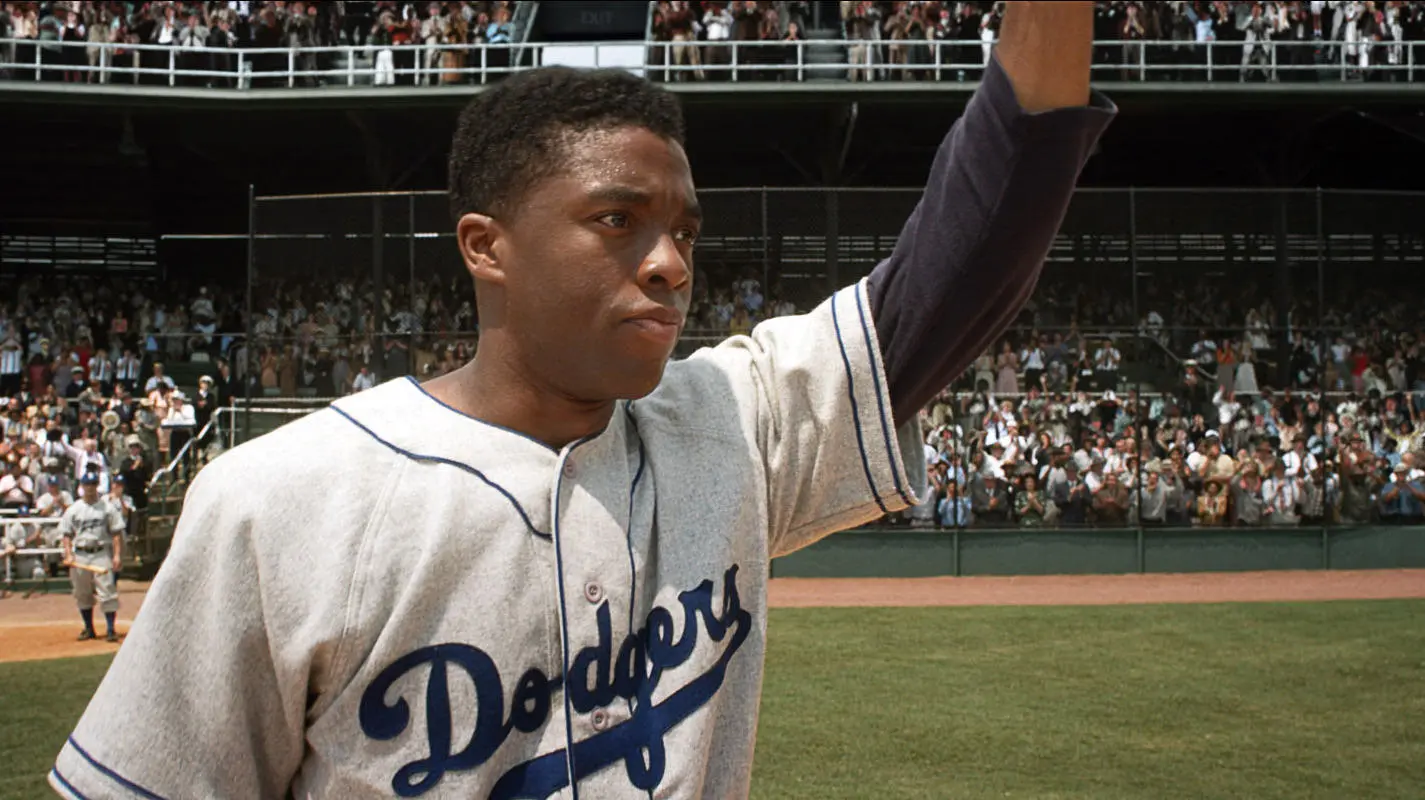 Brooklyn Dodgers first baseman Jackie Robinson (Chadwick Boseman) acknowledges the crowd in 42.