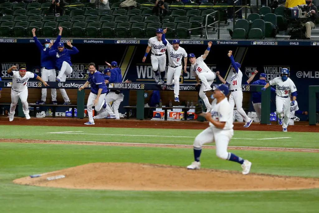 ARLINGTON, TEXAS - OCTOBER 27: The Los Angeles Dodgers celebrate after Julio Urias #7 strikes out Willy Adames #1 of the Tampa Bay Rays to give the Dodgers the 3-1 victory in Game Six to win the 2020 MLB World Series at Globe Life Field on October 27, 2020 in Arlington, Texas