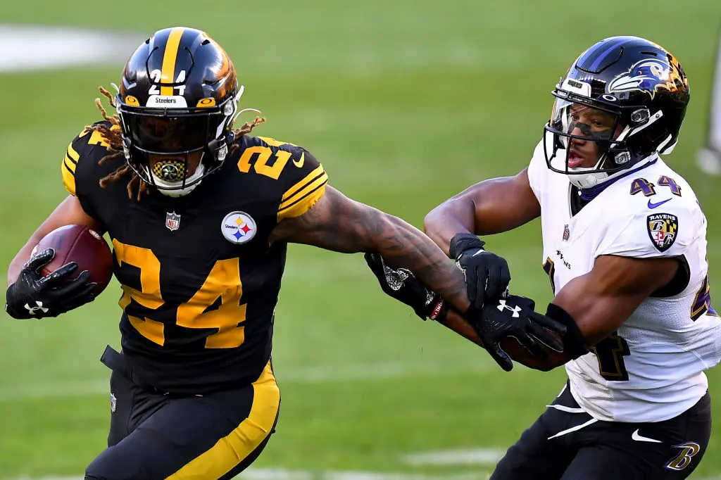 PITTSBURGH, PENNSYLVANIA - DECEMBER 02: Benny Snell #24 of the Pittsburgh Steelers tries to break away from Marlon Humphrey #44 of the Baltimore Ravens during the first quarter at Heinz Field on December 02, 2020 in Pittsburgh, Pennsylvania