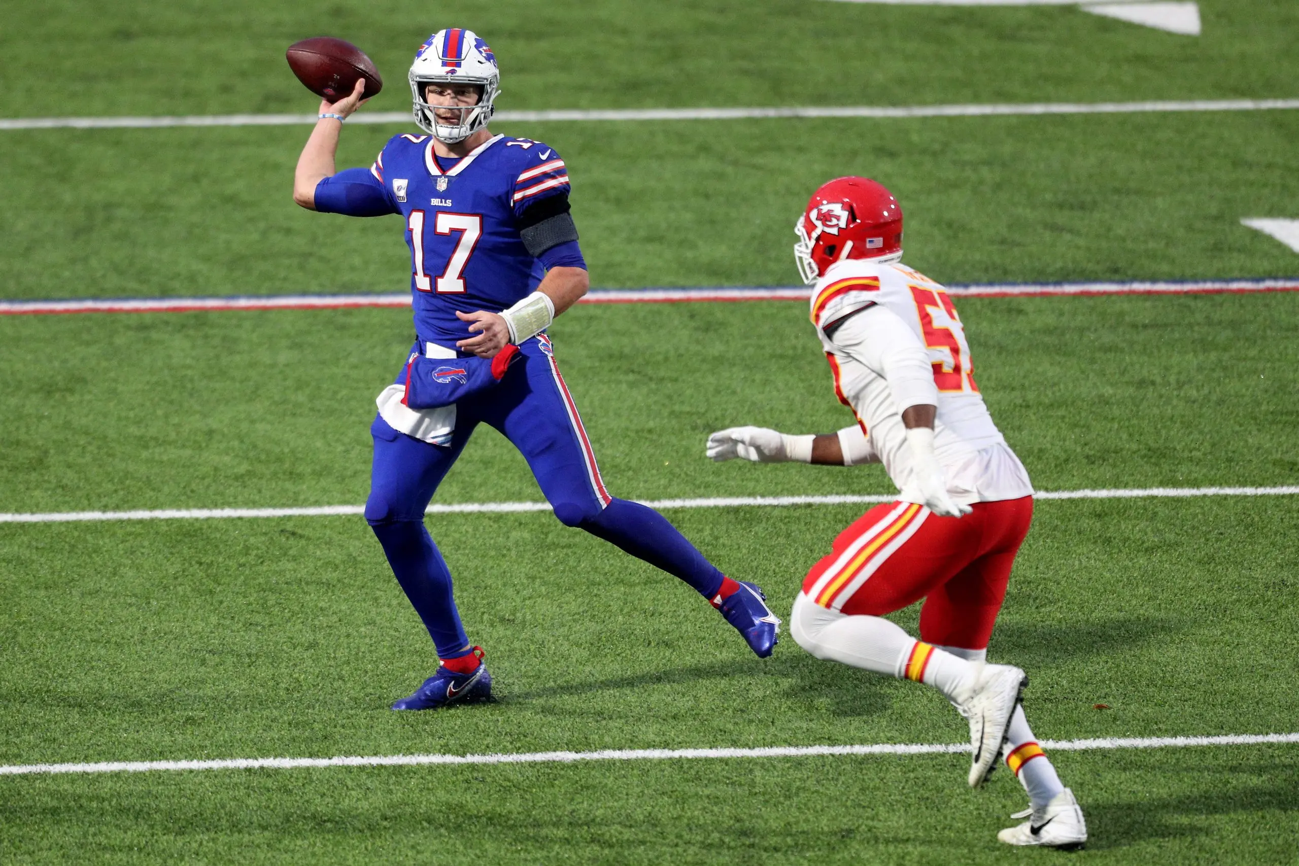 ORCHARD PARK, NEW YORK - OCTOBER 19: Josh Allen #17 of the Buffalo Bills looks to pass as Alex Okafor #57 of the Kansas City Chiefs defends during the second quarter at Bills Stadium on October 19, 2020 in Orchard Park, New York