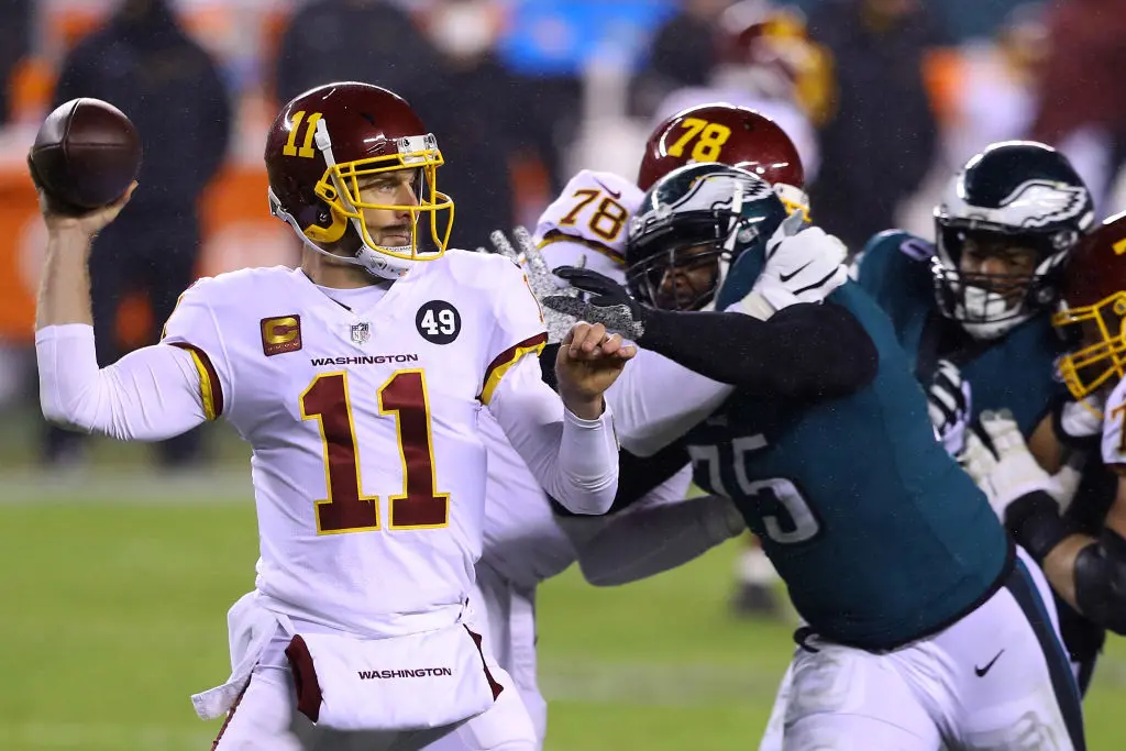 PHILADELPHIA, PENNSYLVANIA - JANUARY 03: Quarterback Alex Smith #11 of the Washington Football Team delivers a pass over defensive end Vinny Curry #75 of the Philadelphia Eagles in the third quarter of the game at Lincoln Financial Field on January 03, 2021 in Philadelphia, Pennsylvania