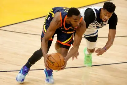 SAN FRANCISCO, CALIFORNIA - JANUARY 25: Andrew Wiggins #22 of the Golden State Warriors and Jarrett Culver #23 of the Minnesota Timberwolves go for a loose ball at Chase Center on January 25, 2021 in San Francisco, California