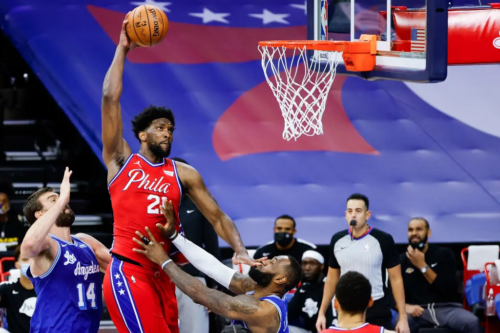 PHILADELPHIA, PENNSYLVANIA - JANUARY 27: Joel Embiid #21 of the Philadelphia 76ers drives to the basket over LeBron James #23 of the Los Angeles Lakers during the fourth quarter at Wells Fargo Center on January 27, 2021 in Philadelphia, Pennsylvania