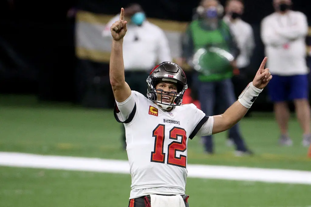 NEW ORLEANS, LOUISIANA - JANUARY 17: Tom Brady #12 of the Tampa Bay Buccaneers celebrates a first down against the New Orleans Saints late in the fourth quarter in the NFC Divisional Playoff game at Mercedes Benz Superdome on January 17, 2021 in New Orleans, Louisiana