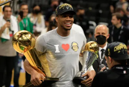 MILWAUKEE, WISCONSIN - JULY 20: Giannis Antetokounmpo #34 of the Milwaukee Bucks holds the Bill Russell NBA Finals MVP Award and the Larry O'Brien Championship Trophy after defeating the Phoenix Suns in Game Six to win the 2021 NBA Finals at Fiserv Forum on July 20, 2021 in Milwaukee, Wisconsin