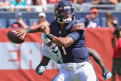 CHICAGO, ILLINOIS - AUGUST 14: Justin Fields #1 of the Chicago Bears passes against the Miami Dolphins during a preseason game at Soldier Field on August 14, 2021 in Chicago, Illinois