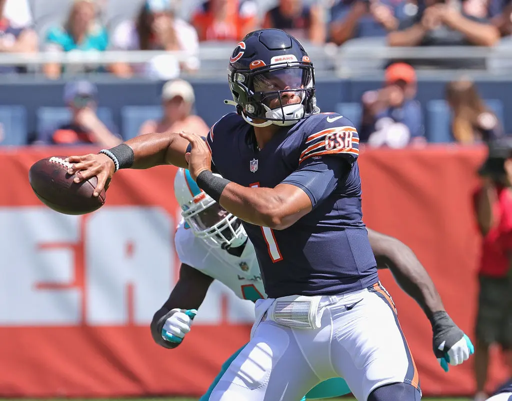 CHICAGO, ILLINOIS - AUGUST 14: Justin Fields #1 of the Chicago Bears passes against the Miami Dolphins during a preseason game at Soldier Field on August 14, 2021 in Chicago, Illinois