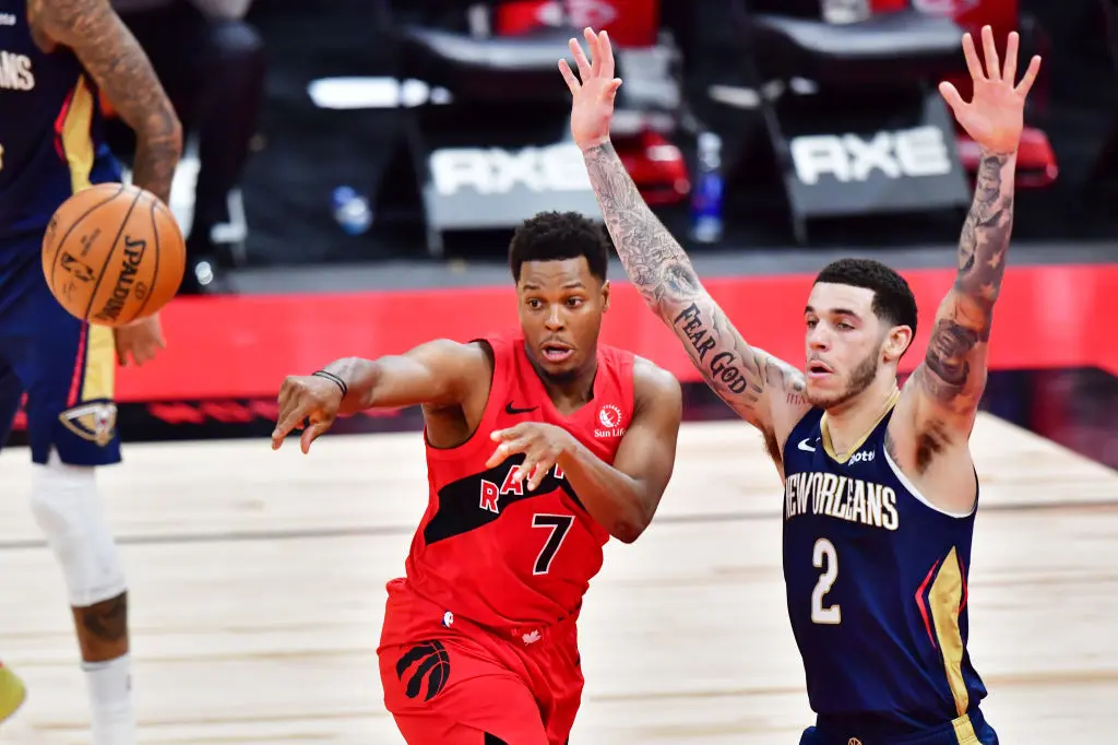 TAMPA, FLORIDA - DECEMBER 23: Kyle Lowry #7 of the Toronto Raptors passes the ball against Lonzo Ball #2 of the New Orleans Pelicans during the second half at Amalie Arena on December 23, 2020 in Tampa, Florida