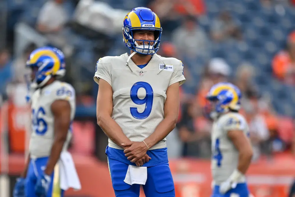 DENVER, COLORADO - AUGUST 28: Matthew Stafford #9 of the Los Angeles Rams looks on as players warm up before a game against the Denver Broncos at Empower Field at Mile High on August 28, 2021 in Denver, Colorado