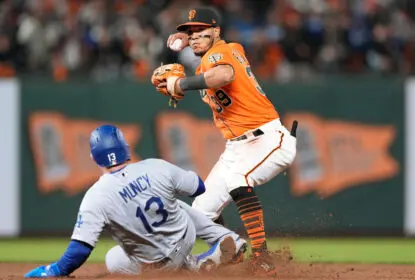 SAN FRANCISCO, CALIFORNIA - SEPTEMBER 03: Thairo Estrada #39 of the San Francisco Giants completes the double-play throwing over the top of Max Muncy #13 of the Los Angeles Dodgers in the top of the six inning at Oracle Park on September 03, 2021 in San Francisco, California