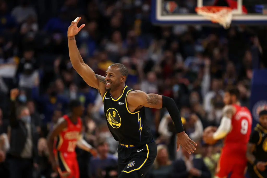 SAN FRANCISCO, CALIFORNIA - NOVEMBER 05: Andre Iguodala #9 of the Golden State Warriors reacts after Gary Payton II #0 of the Golden State Warriors made a basket against the New Orleans Pelicans at Chase Center on November 05, 2021 in San Francisco, California