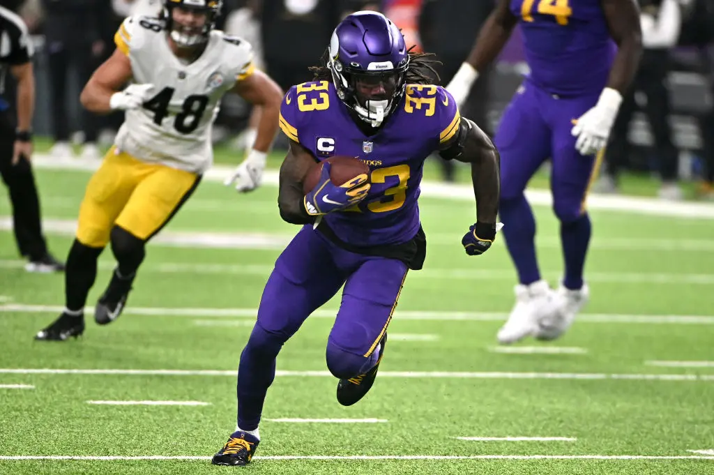 MINNEAPOLIS, MINNESOTA - DECEMBER 09: Dalvin Cook #33 of the Minnesota Vikings carries the ball in the second quarter of the game against the Pittsburgh Steelers at U.S. Bank Stadium on December 09, 2021 in Minneapolis, Minnesota