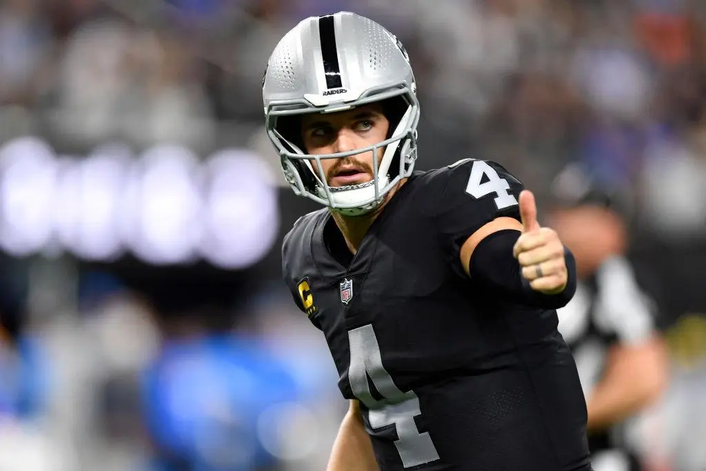 LAS VEGAS, NEVADA - JANUARY 09: Quarterback Derek Carr #4 of the Las Vegas Raiders lines up for a play against the Los Angeles Chargers during the first half of a game at Allegiant Stadium on January 09, 2022 in Las Vegas, Nevada. The Raiders defeated the Chargers 35-32 in overtime