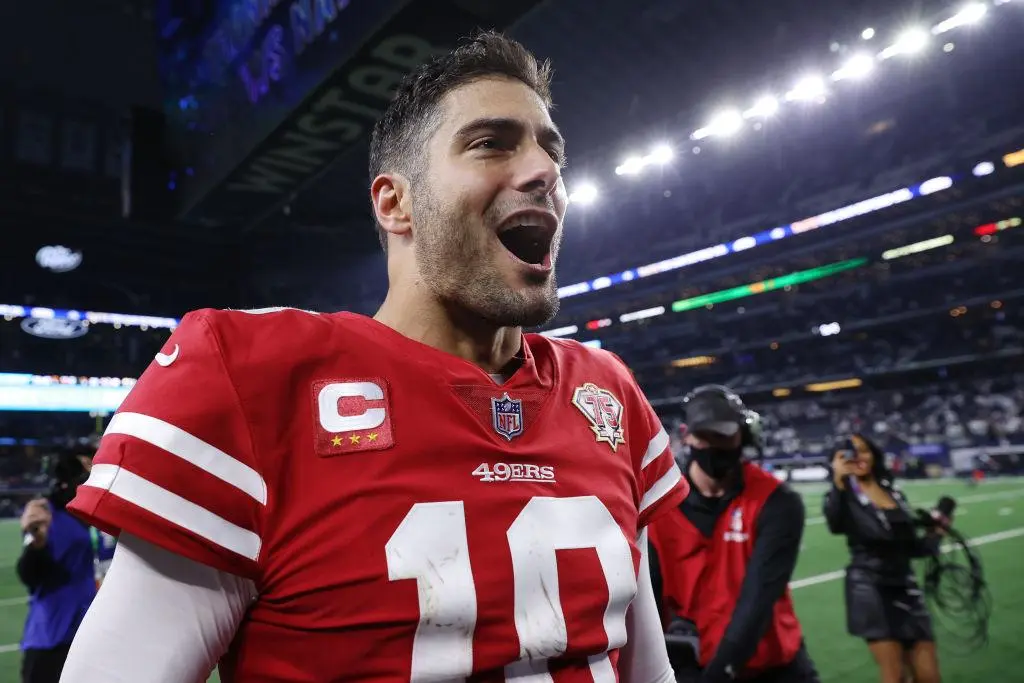 ARLINGTON, TEXAS - JANUARY 16: Jimmy Garoppolo #10 of the San Francisco 49ers walks off the field after defeating the Dallas Cowboys 23-17 in the NFC Wild Card Playoff game at AT&T Stadium on January 16, 2022 in Arlington, Texas.