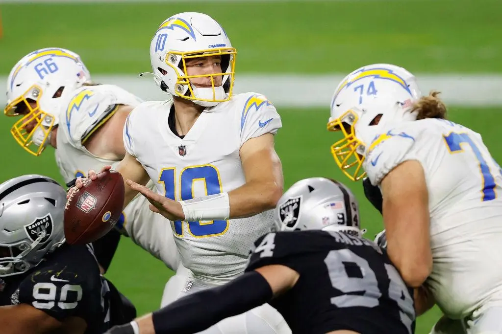 LAS VEGAS, NEVADA - DECEMBER 17: Quarterback Justin Herbert #10 of the Los Angeles Chargers drops back to pass during the third quarter of the NFL game against the Las Vegas Raiders at Allegiant Stadium on December 17, 2020 in Las Vegas, Nevada. The Chargers defeated the Raiders in overtime 30-27